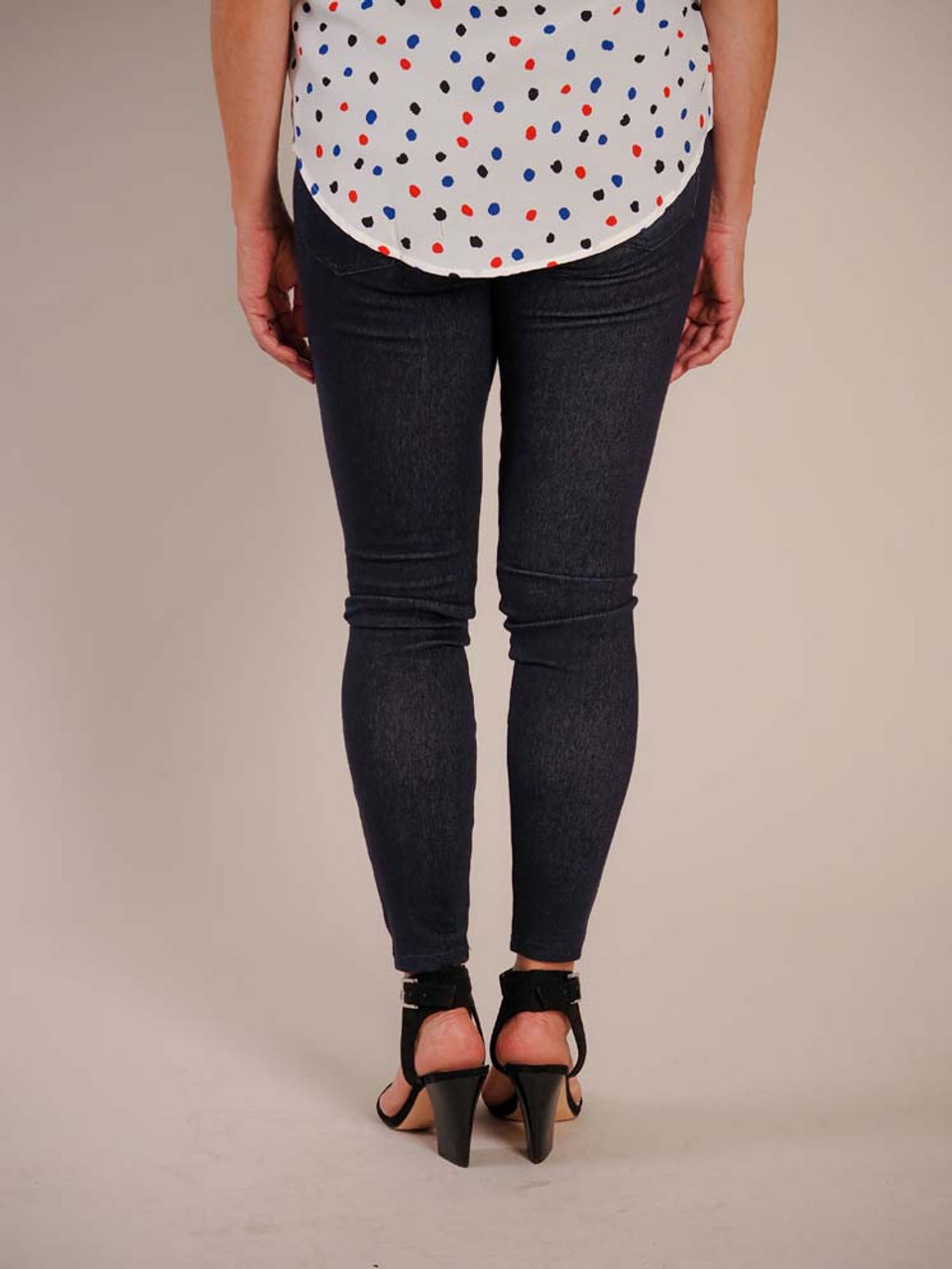 Dark navy jeggings with front and back pockets and decorative button at top of faux-fly