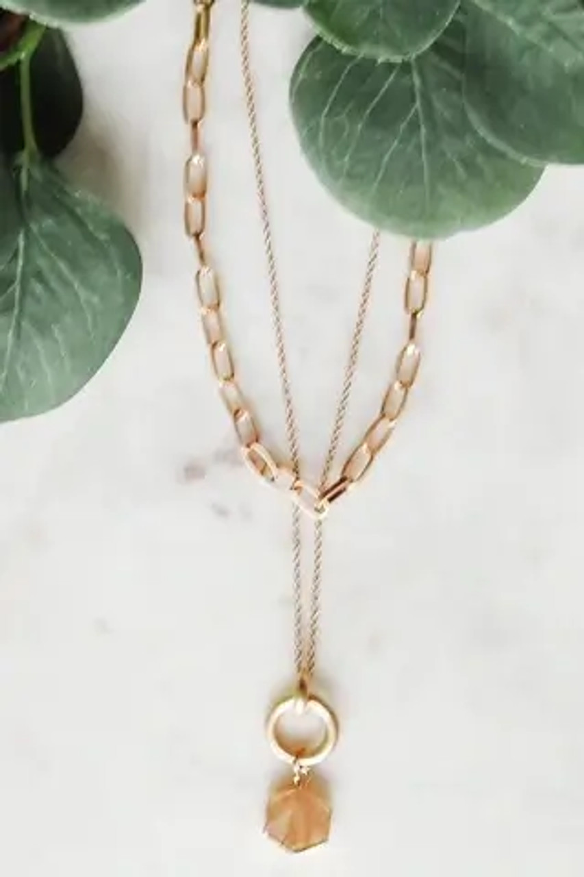 Two-layer gold tone necklace with natural stone pendant and lobsterclaw close. Adjustable from 14.5" to 17.5"; longer chain drops an additional 1.5". Pendant is 1.5" long. Nickle and lead free.