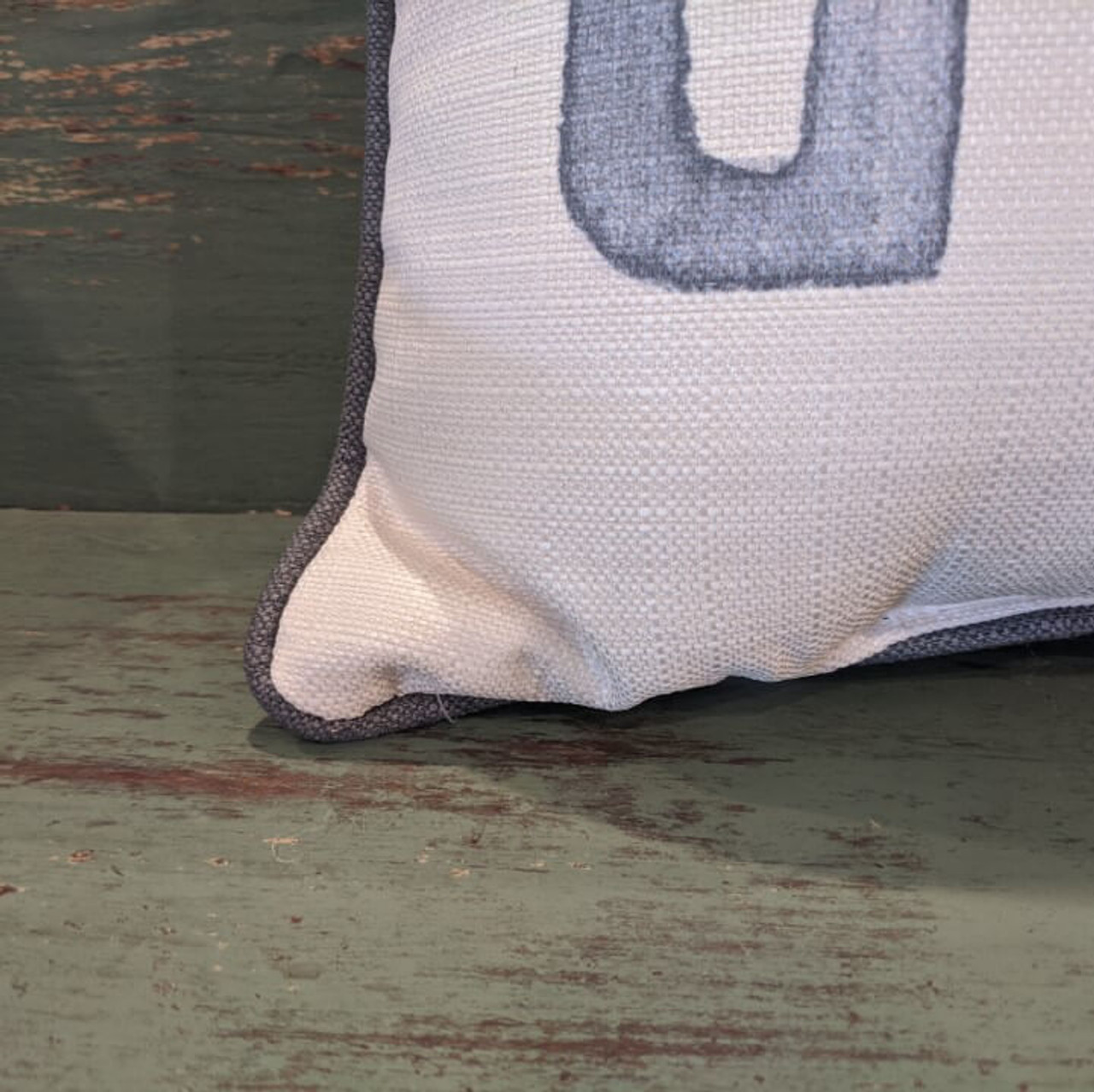 The perfect way to cozy up any space! "Be our guest" sentiment is dyed directly into the fabric, so it won't peel or crack; grey piping around the edge for an extra pop! Made from a soft yet durable polyester fabric, your pillow will arrive stuffed with poly-fill and sewn shut.  Approx. 20" W x 14” H; machine washable in cold water, delicate cycle- fluff, air dry flat.