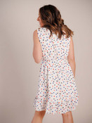 Charming summer dress. V-neck with ruffle detail and three buttons to elastic waist; wide matching belt to tie; sleeveless; ruffle detail at shoulder; fully lined; 5" ruffle detail at hem