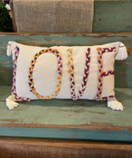 Multi-color Chindi fabric "LOVE" applique on 24"L x 14"H cotton lumbar pillow. Insert included. Each Chindi fabric applique is unique; this one features orange and soft yellow fabrics.