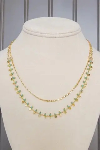 turquoise gold Two layer beaded necklace with lobsterclaw clasp. Adjustable from 15" to 17"; longer chain drops an additional inch. Nickle and lead free. turquoise gold Two layer beaded necklace with lobsterclaw clasp. Adjustable from 15" to 17"; longer chain drops an additional inch. Nickle and lead free.