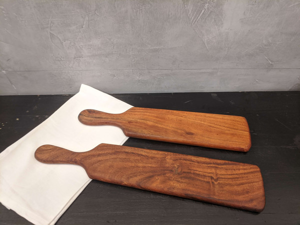 Beautifully display your finger foods, charcuterie, and other snacks on these gorgeous appetizer trays. They're made from sturdy acacia wood for strength and charm. These trays are approx 4" wide and 11/16" thick; the larger tray is 19.5" long and the smaller is 17" long. Wipe clean with a damp cloth. Beautifully display your finger foods, charcuterie, and other snacks on these gorgeous appetizer trays. They're made from sturdy acacia wood for strength and charm. These trays are approx 4" wide and 11/16" thick; the larger tray is 19.5" long and the smaller is 17" long. Wipe clean with a damp cloth.