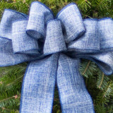 Close-Up of Hand-Tied Blue Linen Bow on Bar Harbor Christmas Wreath
A detailed shot of the soft, hand-tied wired blue linen bow that adds a rustic, elegant touch to the Bar Harbor Fresh Christmas Wreath. 