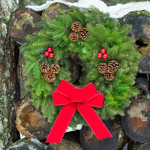 Downeaster Fresh Christmas Wreath with Red Velvet Bow
A handcrafted Downeaster Fresh Christmas Wreath, made from fresh balsam fir and decorated with natural pine cones and clusters of faux red berries. Topped with a hand-tied red velvet bow, this classic wreath is perfect for adding traditional holiday charm to any front door.