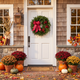 1. Cape Elizabeth fresh balsam wreath with cranberry bow on a white front door decorated for fall