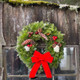 Original Wreath Hung on Front Door
The Original Christmas Wreath hanging on a front door, displaying its lush greenery and rustic decorations. With its traditional design and natural materials, this wreath adds a classic Maine charm to your holiday decor.