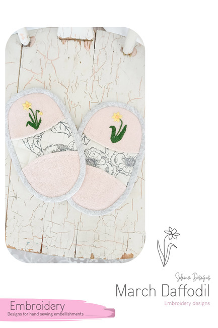 March Daffodil embroidery file shown on Solar Flare potholders by Sofiona Designs.