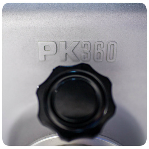 PK360 Grill & Smoker, close-up of the black control knob and embossed PK360 logo on the silver metallic surface.