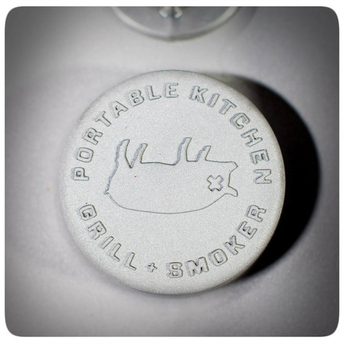 The PK360 Grill & Smoker, close-up view of the top lid with engraved logo and text, part of the AmazingRibs.com Special Offer.