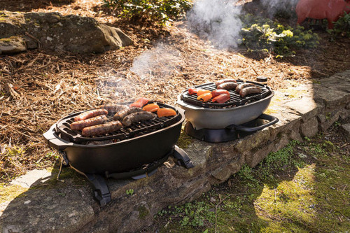 PK Grills PKGO QR Landing Page, outdoor portable grills cooking various sausages and vegetables on a backyard stone surface.