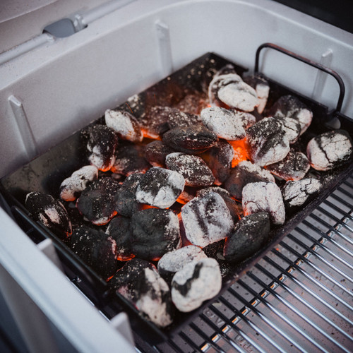 PK Grills PK300 Performance Accessory Bundle, charcoal briquettes in a grill.