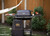 PK Grills PK300AF Start Cookin' Bundle - Coal, outdoor charcoal grill with accessories in backyard setting.