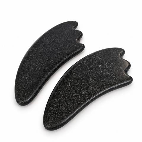2 Pc Gua Sha Stone Set featuring two natural black basalt massage stones with ergonomic crescent shapes and smooth contoured edges.