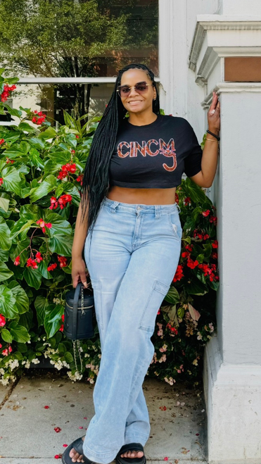 Shop the CINCY Rhinestone Cropped Tee featuring sparkling orange, black and crystal rhinestones. A bold Cincinnati-inspired women's game-day shirt perfect for football season, tailgates and Cincy Street style.