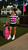 Woman wearing Legacy Club cropped striped polo shirt with biker shorts at luxury country club.