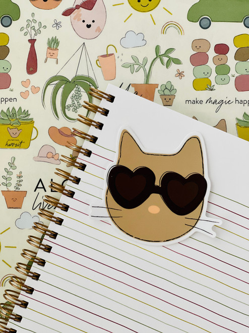 adhesive sticker in the shape of a cat with sunglasses on