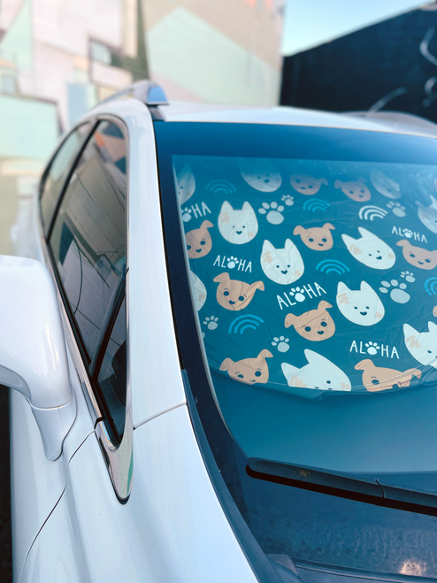 sun shade in car with dogs on it