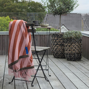 Mette Ditmer Retro Throw in Rust Over Chair on Deck Mette Ditmer Retro Throw in Rust Over Chair on Deck