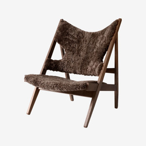 Audo Copenhagen Knitting Lounge Chair in Root Sheepskin with Dark Stained Oak Base Audo Copenhagen Knitting Lounge Chair in Root Sheepskin with Dark Stained Oak Base