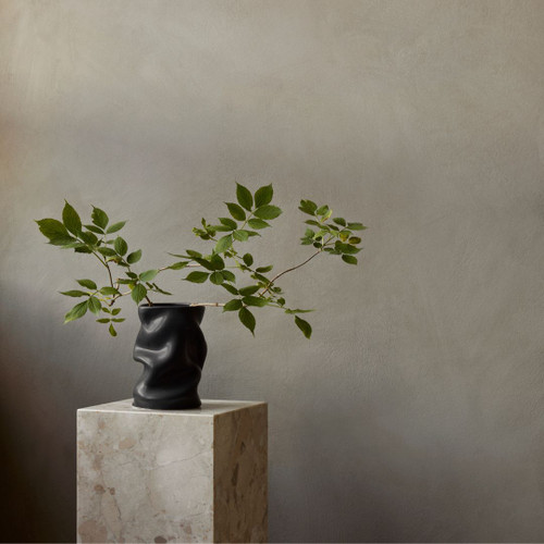 Audo (Menu) Collapse Vase 20cm in Black on Plinth with Greenery