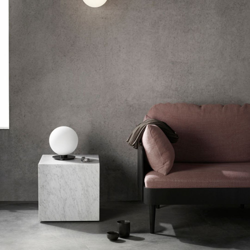 Audo Copenhagen Plinth Cubic in White Carrara Marble Next To Lounge Audo Copenhagen Plinth Cubic in White Carrara Marble Next To Lounge