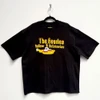 The Beatles 'Logo & Sub' (Black) Oversized Boxy T-Shirt - Limited Edition on a hanger