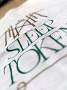 Sleep Token 'The House Must Endure' (White) T-Shirt close up detail of breast pocket motif
