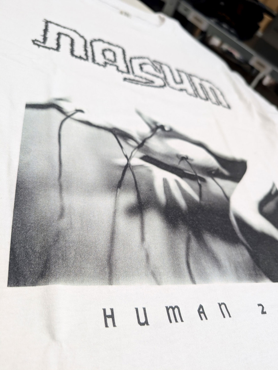 Nasum 'Human 2.0' (White) T-Shirt close up of the print detail 2