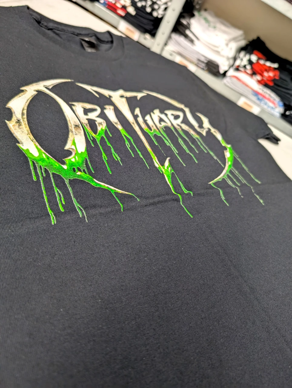 Obituary 'Slowly We Rot Logo' (Black) T-Shirt close up detail 1
