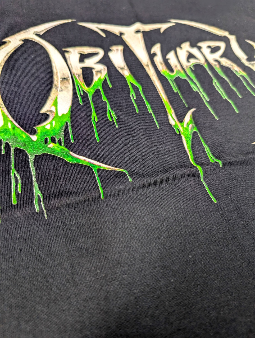 Obituary 'Slowly We Rot Logo' (Black) T-Shirt close up detail 2