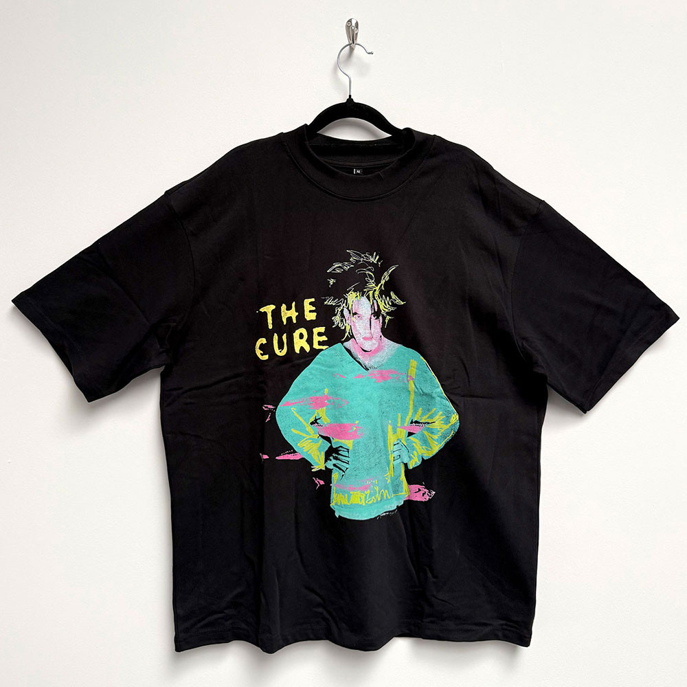 The Cure 'Beach Party Tour '86' (Black) Oversized Boxy T-Shirt - Limited Edition Front on a hanger