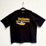 The Beatles 'Logo & Sub' (Black) Oversized Boxy T-Shirt - Limited Edition on a hanger