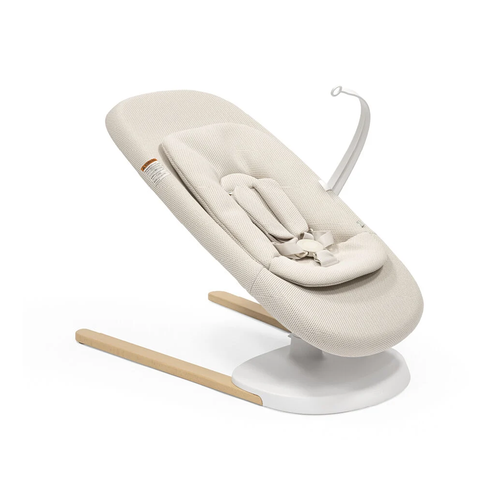 Stokke® Yoga™ Baby Bouncer & Swing Light Sand - Soothe, entertain, and stimulate your baby with Stokke® Yoga™. This dual-movement baby bouncer serves as both a bouncer and a swing and is designed for even the smallest of newborns.