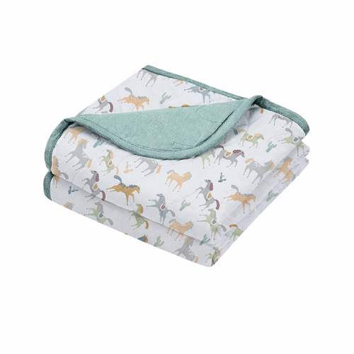 Nest Designs Cozy Blanket 26SS Pony Express S - Our quilted blanket, made with soft bamboo jersey and Sorona® fill, delivers plush warmth without the weight.