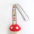 A clip with a mushroom toy made of fluffy knit.