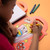 OMY Super Coloring & Sticker Book - Yummy - A 35-page food truck-shaped coloring book. A delicious world full of popcorn, silly ice creams, and hot dogs...