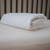Naturepedic Waterproof Organic Mattress Pad 28" x 52" x 6" - Keep your toddler’s sleep space cozy and clean with an organic crib mattress pad crafted from soft, quilted cotton and GOTS-approved waterproofing.