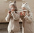 Huttelihut Balaclava Ears Wool Sand Melange - This Huttelihut balaclava is crafted from a soft wool blend and features two cozy layers for extra warmth. Designed with adorable teddy bear ears and a comfortable ribbed edge, this balaclava ensures a snug fit and includes a split design for extended neck coverage.