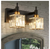 EDISLIVE Orillia 11.8 in. 2-Light Modern Black Gold Bathroom Vanity Light