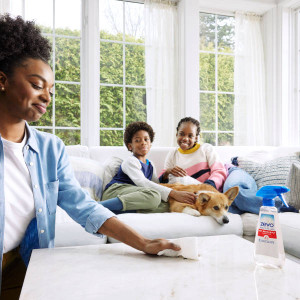 Hand Wiping Counter With A Paper Towel.