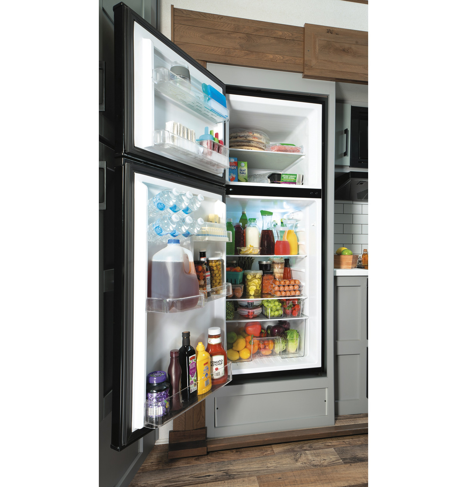 GE GPV10FGNBB 24" Top Freezer Refrigerator with 9.93 cu. ft. Capacity 12V DC Power Only LED Lighting and Adjustable Spillproof Glass Shelves in Black on Fridge.com