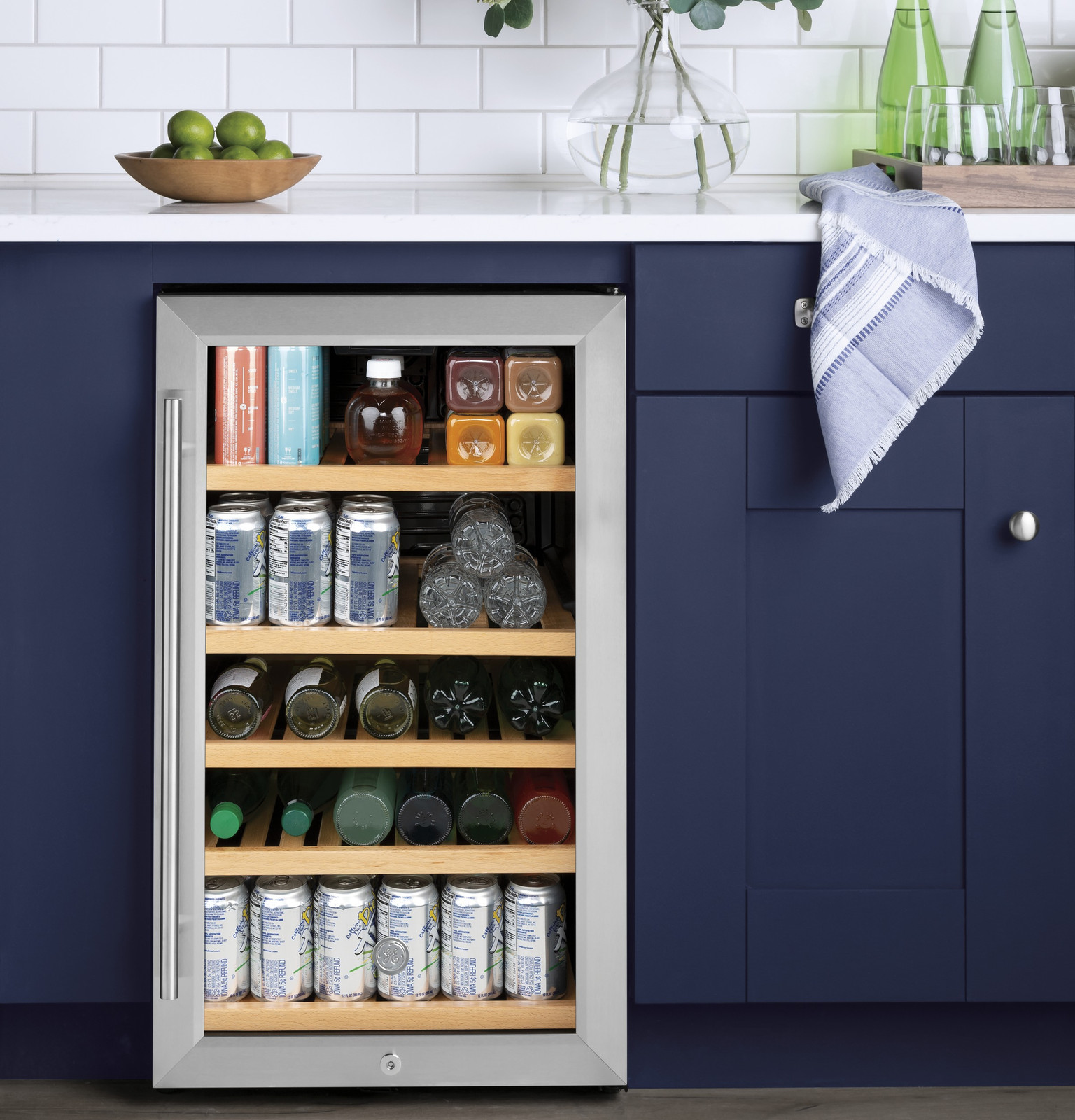 GE Wine Cooler & Beverage Refrigerator | Mini Fridge With Lock & Key Included | Complete With Oak Shelving, Glass Exterior & Warm Interior Lighting | Fits 109 Cans or 31 Wine Bottles | Stainless Steel on Fridge.com