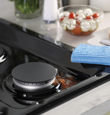 GE® 36" Built-In Gas Cooktop with Dishwasher-Safe Grates in Black size 4.75 H x 36 W x 21 D | JGP3036DLBB | Standard Cast