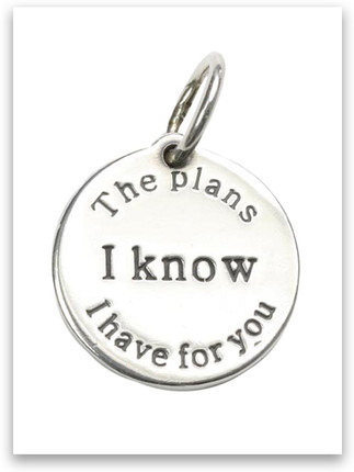 Round silver charm engraved with the words 'the plans I have for you' surrounding 'I Know' in bold, inspired by Jeremiah 29:11. Simple, faith-based jewelry piece. Round silver charm engraved with the words 'the plans I have for you' surrounding 'I Know' in bold, inspired by Jeremiah 29:11. Simple, faith-based jewelry piece.