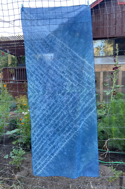 Indigo blue and shibori scarf with subtle triangular white accent