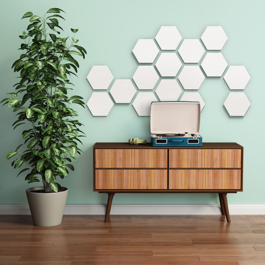 Synergy™ Hexagon-10 panels shown in White mounted on wall.