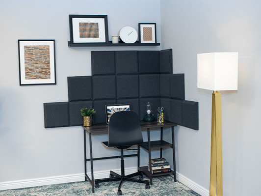 Auralex Home Office Kit™ installed on the wall in a small home office - shown in Charcoal