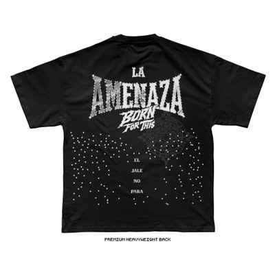 Back of black premium heavyweight tee with large LA AMENAZA Born For This graphic, tonal Aztec calendar print, scattered white dot cascade, and El Jale No Para text.