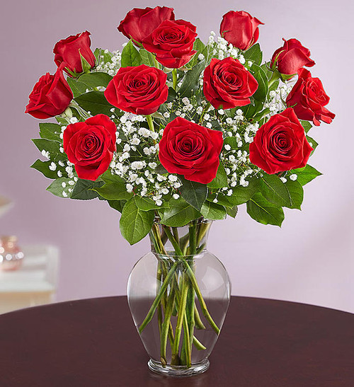 Our premium long stem red roses are an elegant surprise for the one you can trust, the one you can turn to, the one you love with all your heart. Beautifully arranged by our expert florists with lush greenery inside a classic glass vase, 12 or 18 radiant blooms are hand-delivered and ready to delight them for any romantic reason.
